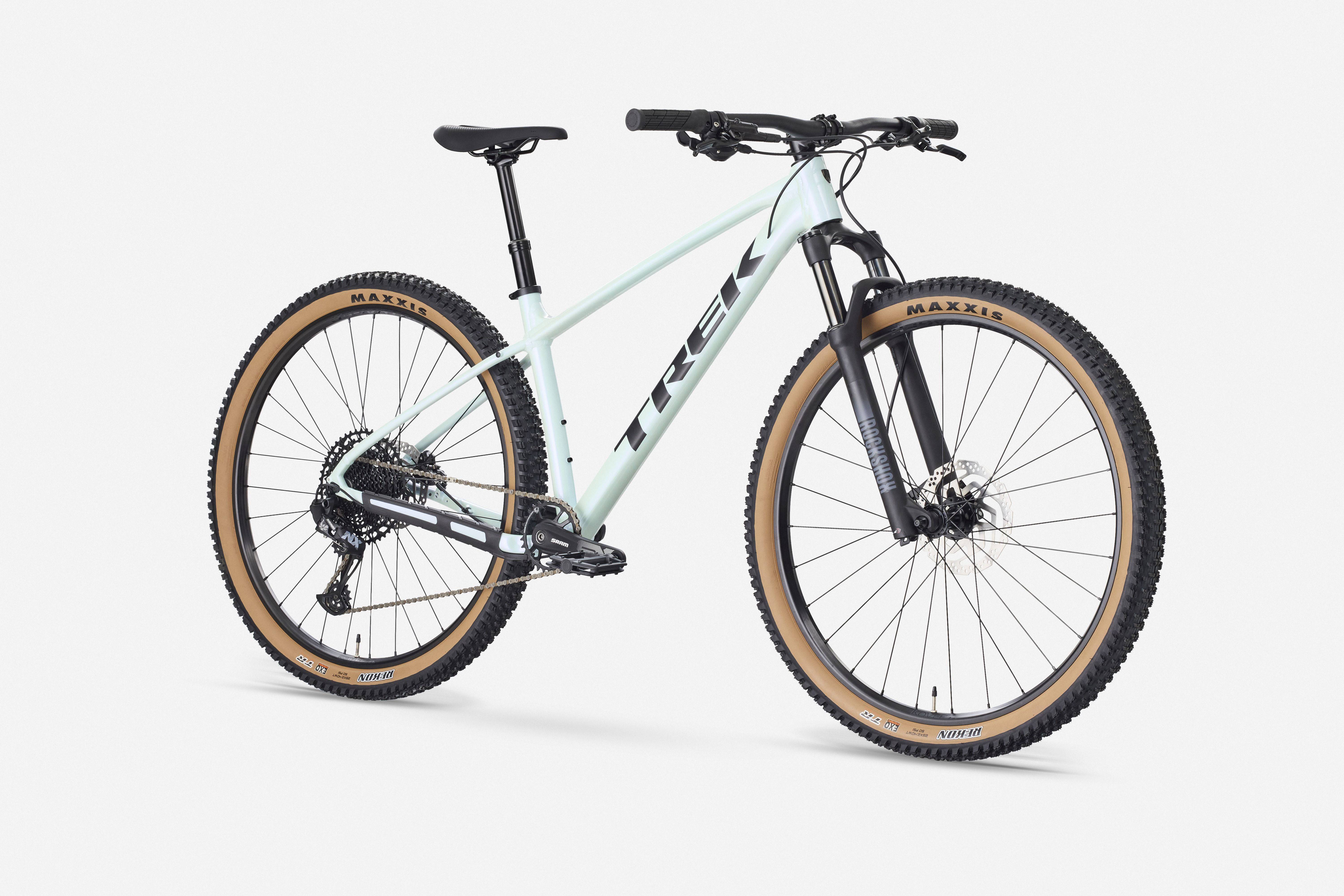 Trek Marlin 7 Gen 3 mountain bike with a black frame and front suspension, ready for trail riding and outdoor adventures.