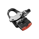 LOOK Keo 2 Max Vision road pedals with integrated 60-lumen rear light and USB-C rechargeable feature, mounted on a bicycle crank.