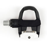 Look Keo Classic 3 road bike pedals with Keo Grip cleats in black and white, showcasing their sleek design and pedal mechanism.