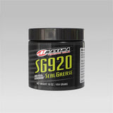 RockShox MAXIMA Grease SG920 suspension grease for forks and shocks, shown in a workshop setting with a tube of grease.