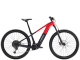 Trek Powerfly+ 4 electric mountain bike with Shimano CUES 10-speed and SR Suntour suspension fork, shown from a side angle.