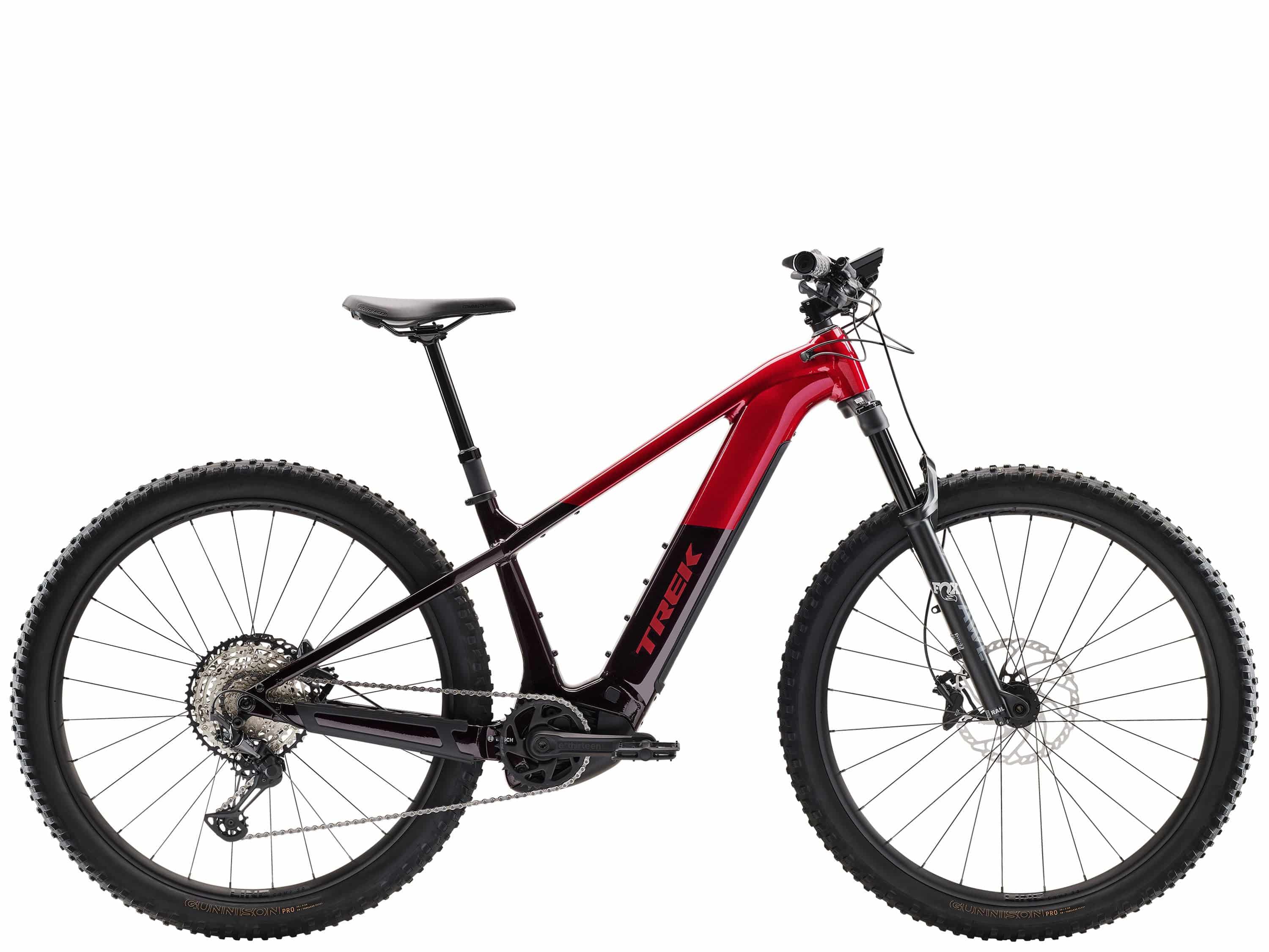 Trek Powerfly+ 8 electric mountain bike with Gen 5 motor and Shimano Deore XT drivetrain, black frame and knobby tires.