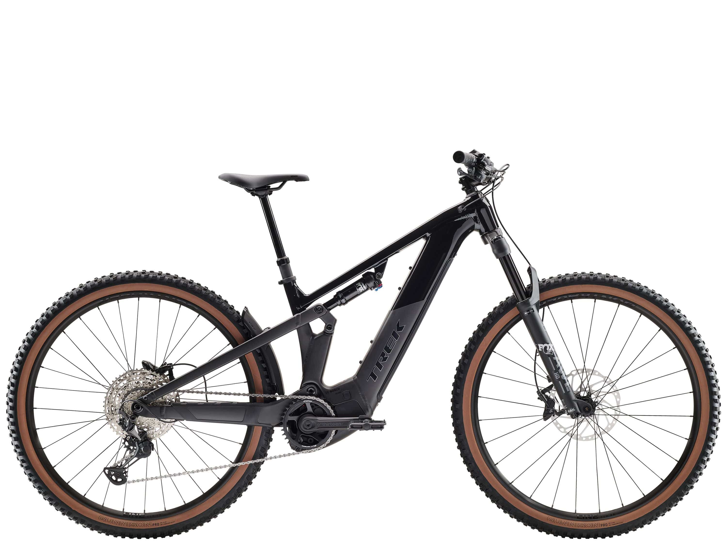 Trek Powerfly FS+ 6 2025 electric mountain bike with Shimano Deore XT gears and Gen 4 system, shown in a rugged outdoor setting