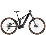 Trek Powerfly FS+ 6 2025 electric mountain bike with Shimano Deore XT gears and Gen 4 system, shown in a rugged outdoor setting