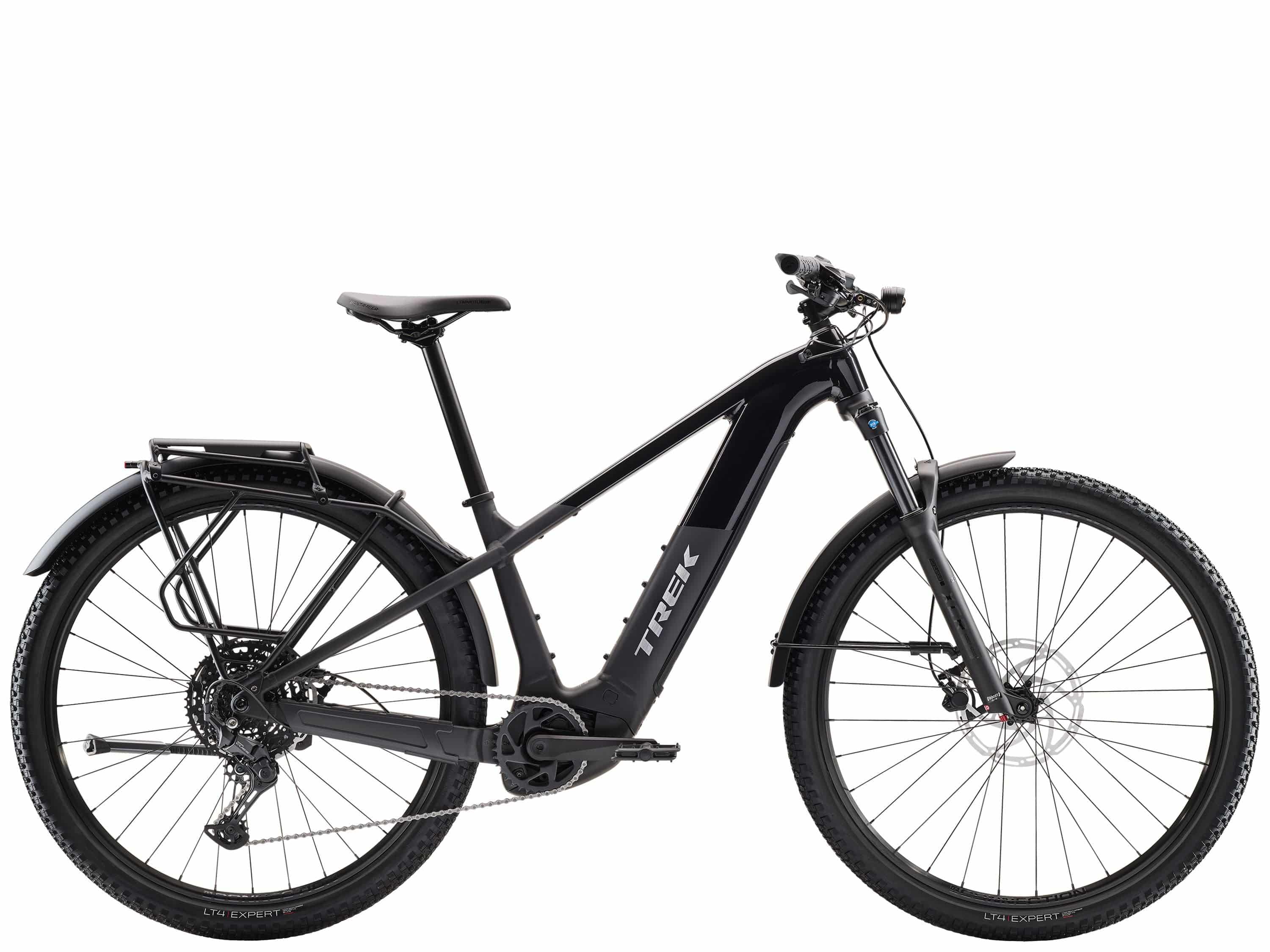 Trek Powerfly+ 4 EQ electric mountain bike with 29-inch wheels and Gen 5 motor, shown in a natural outdoor setting.