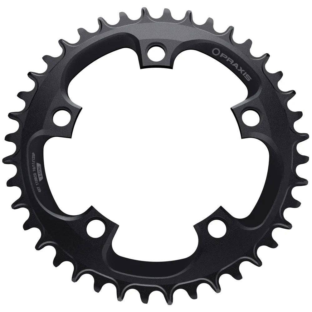 Praxis Works 46T narrow wide chainring for 110 BCD road and gravel 1x drivetrain, with black finish and mounting holes visible.