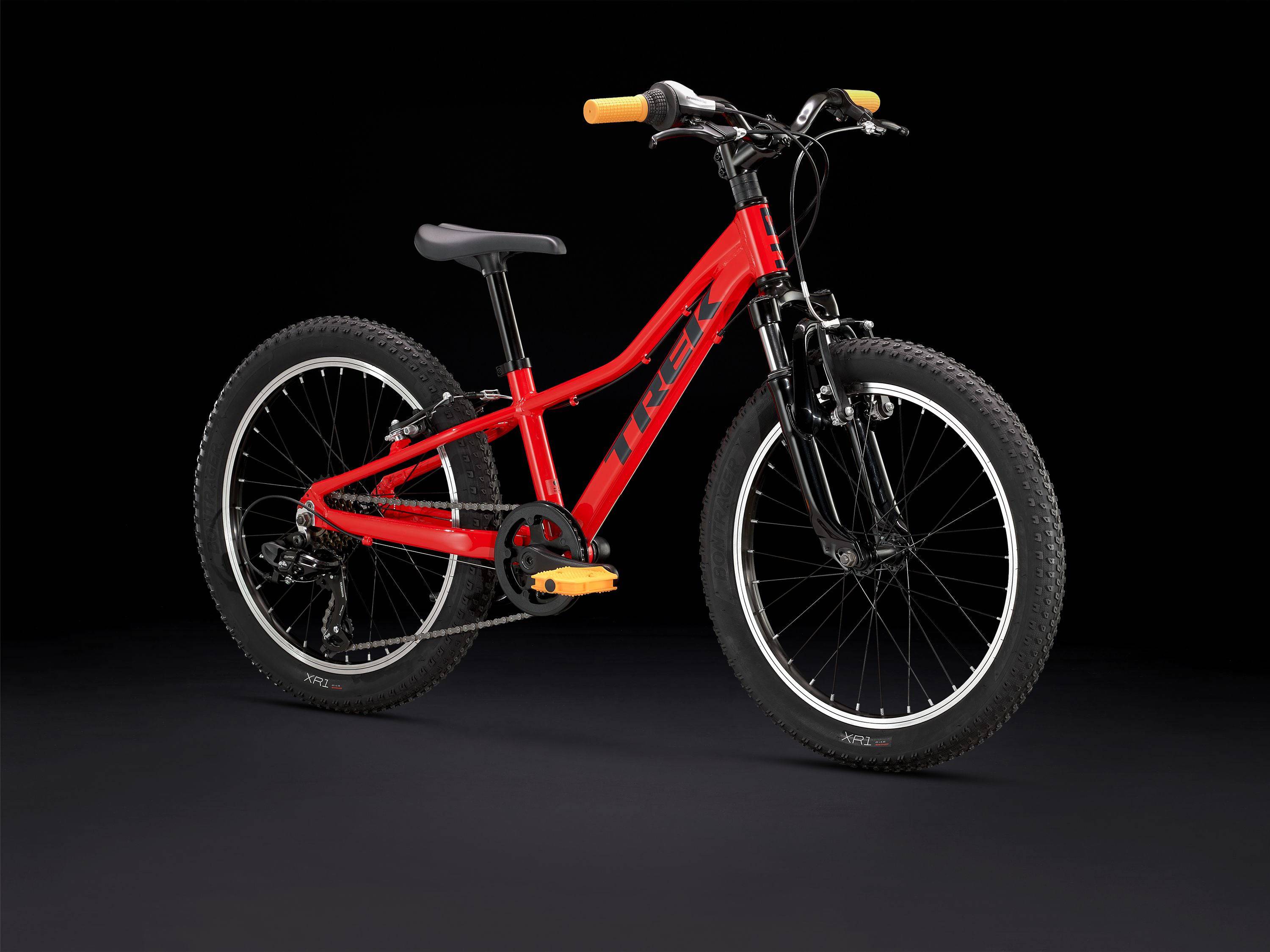Trek Precaliber 20 kids' mountain bike with 7-speed gearing, parent handle, and rugged frame for learning and trail riding.