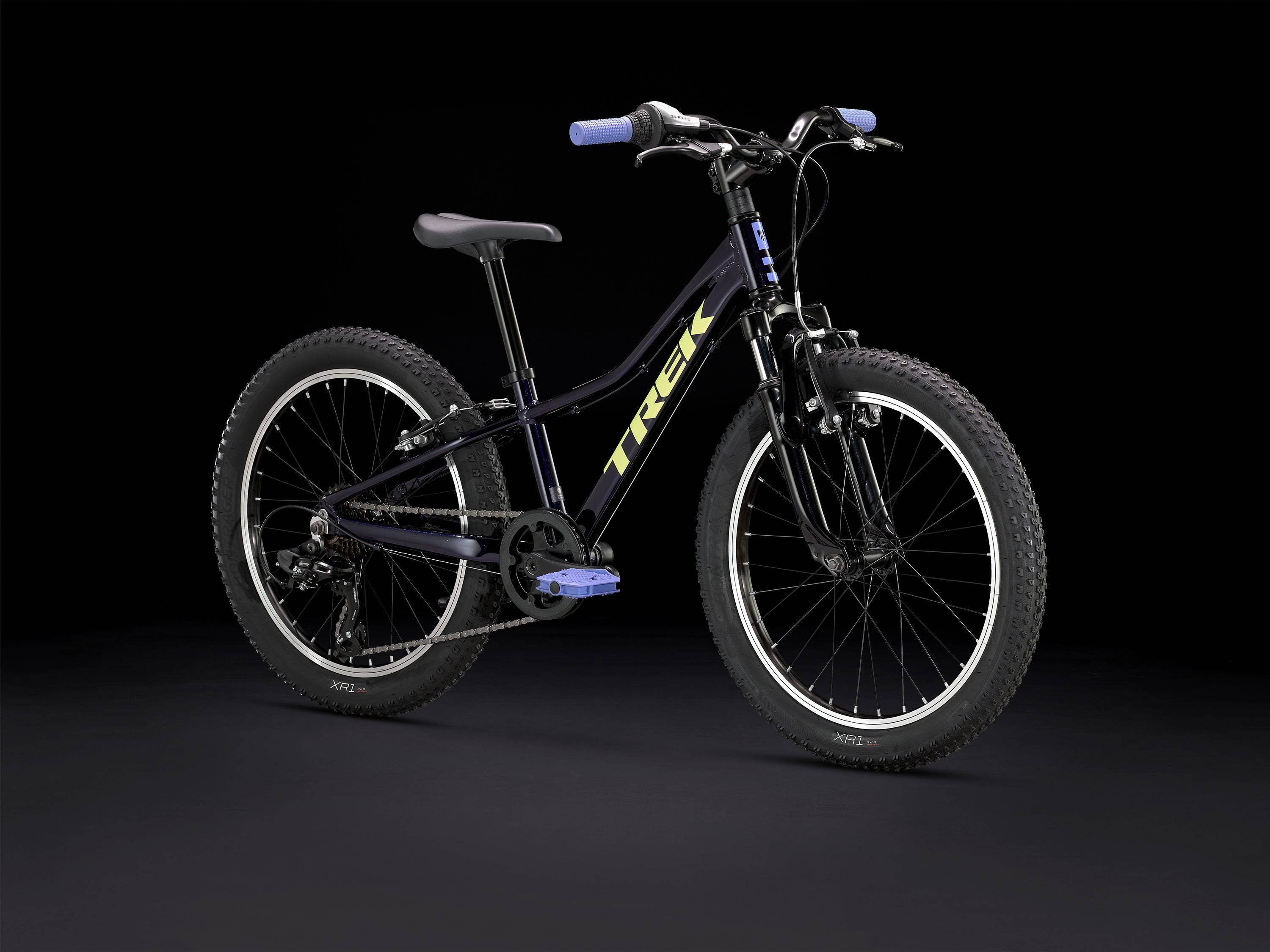 Trek Precaliber 20 kids' mountain bike with 7-speed gear, parent handle, and sturdy frame for learning and trail riding.