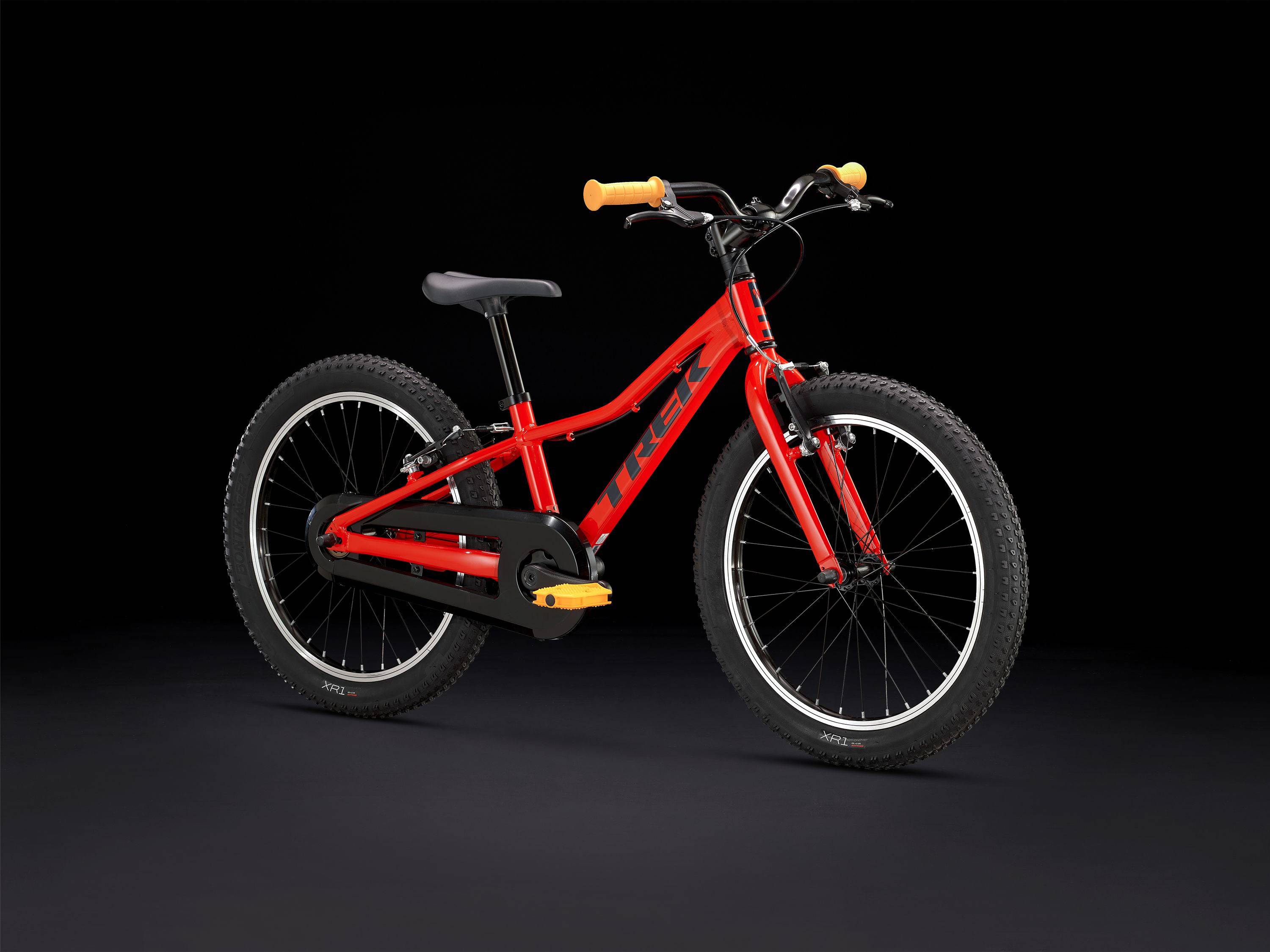 Trek Precaliber 20 kids mountain bike with integrated handle for trail riding, featuring a sturdy frame and colorful design.