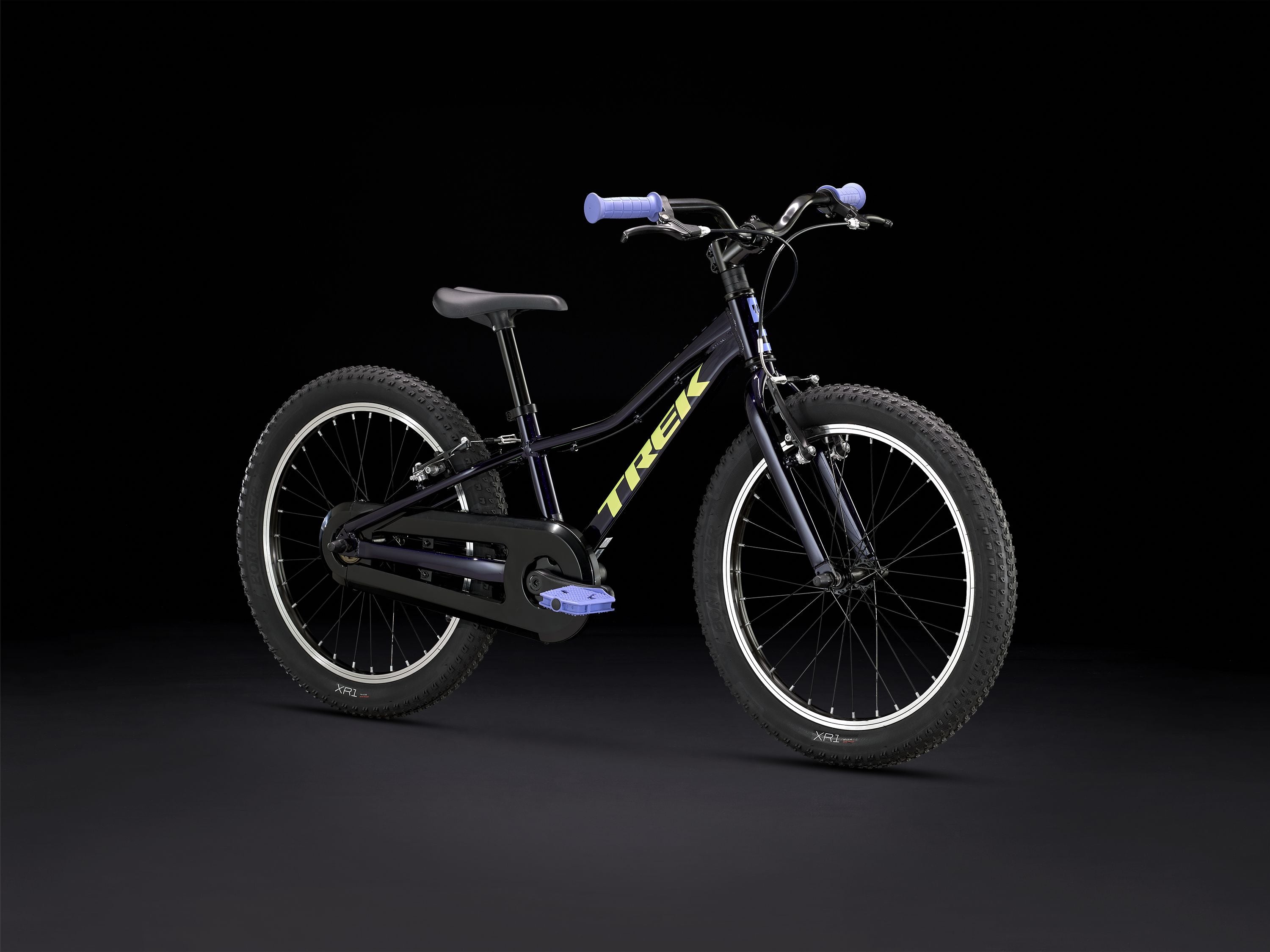 Trek Precaliber 20 kids' mountain bike with integrated handle, ready for trail riding, featuring sturdy frame and colorful design.