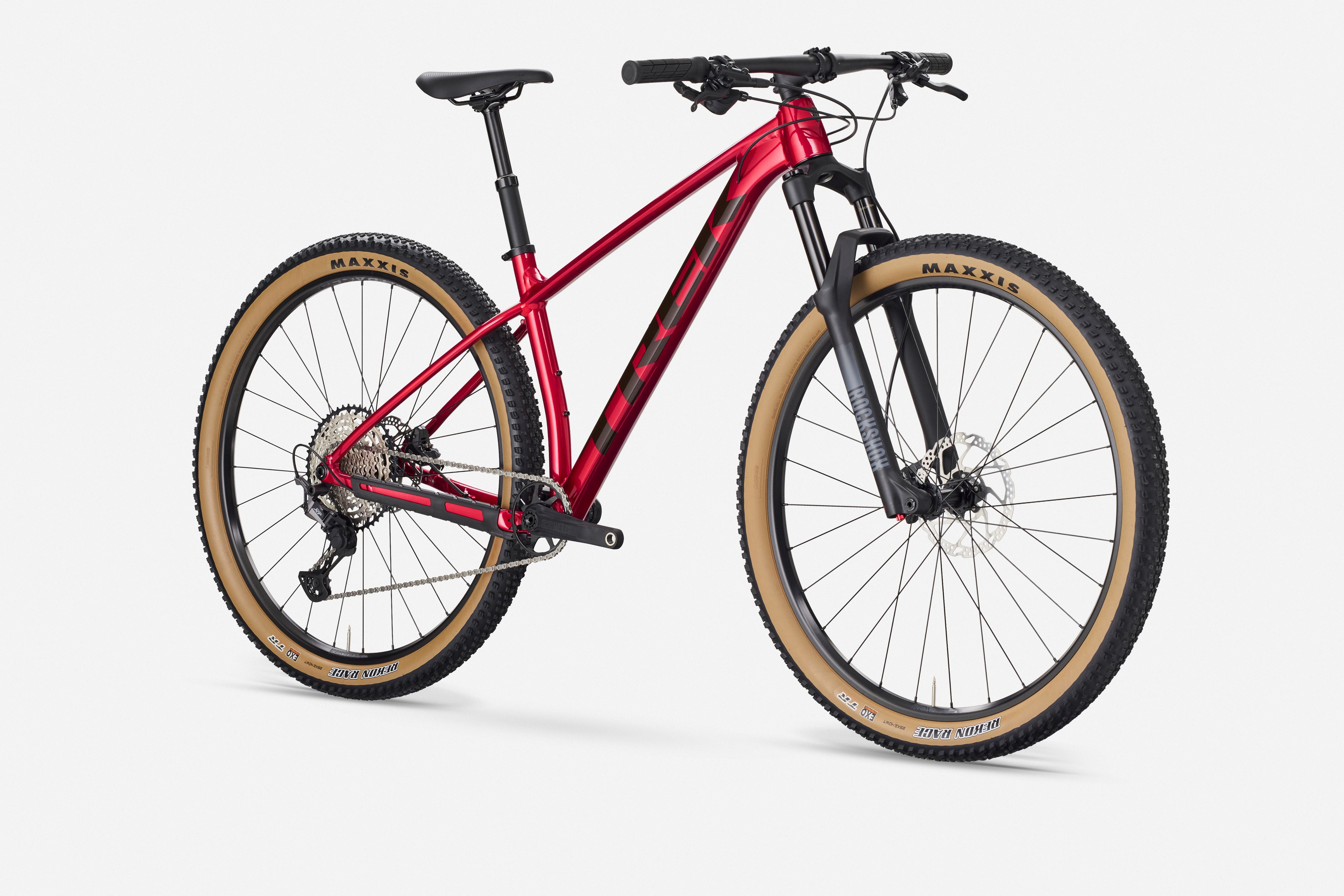 Trek Procaliber 8 mountain bike with Shimano XT groupset, off-road trail riding, black frame, front suspension, and knobby tires.