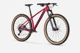 Trek Procaliber 8 mountain bike with Shimano XT groupset, off-road trail riding, black frame, front suspension, and knobby tires.