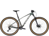 Trek Procaliber 9.5 Gen 3 mountain bike featuring IsoBow frame technology and 26-inch wheels for trail riding.
