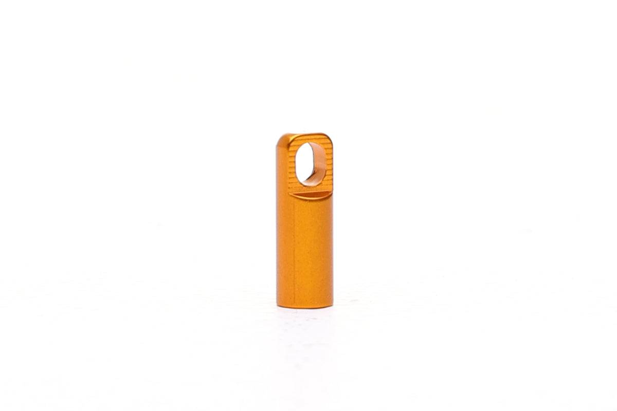 Fatty's Valve Dustcap with integrated valve removal tool, gold-colored workshop accessory for easy tire valve maintenance.
