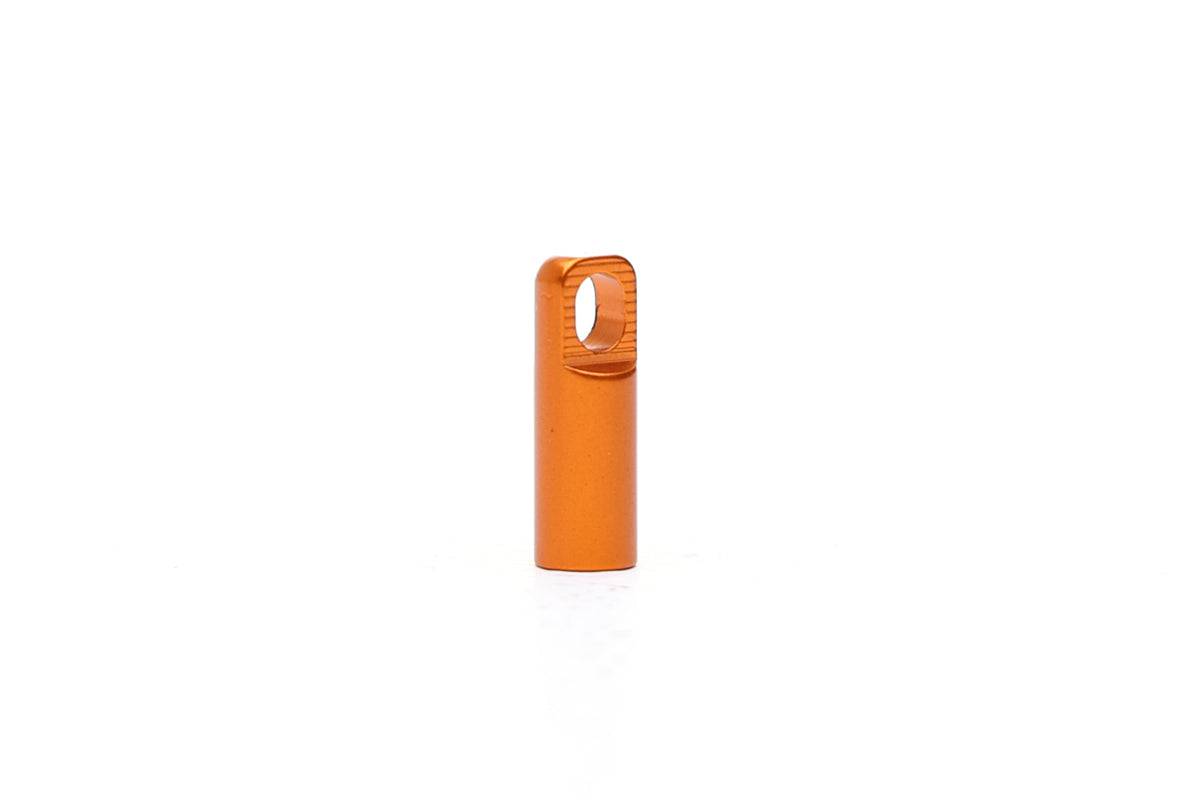 Orange Fatty's Valve Dustcap with integrated valve removal tool for easy maintenance, shown in a workshop setting.