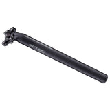 Ritchey Comp Carbon 2-Bolt seatpost made of matte UD carbon fiber for bike component, showing sleek, lightweight design with clamp mechanism.