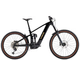 Trek Rail+ 8 electric mountain bike featuring a sleek frame, Shimano Deore XT groupset, and Gen 5 motor in a scenic outdoor setting.