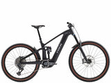Trek Rail+ 9.8 GX AXS 2025 electric mountain bike with 29-inch wheels and Gen 5 motor, showing the bike frame and suspension.