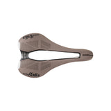 Selle Italia SLR Boost Gravel Ti316 Superflow saddle with light gel padding and high-visibility inserts, designed for gravel cycling.