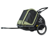 Green Hamax Pluto Medium Dog Trailer 2023 with bike trailer and stroller kit, showcasing the durable, enclosed dog transportation accessory.