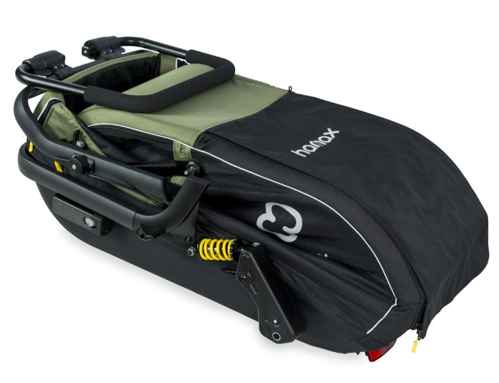 Green Hamax Pluto Medium Dog Trailer from 2023, showing the bike trailer and stroller kit accessories for medium-sized dogs.