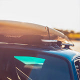 SeaSucker Board Rack for surf and paddle boards with vacuum mounts attached to a car roof, showcasing secure transportation accessories.