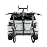SeaSucker Bomber 3 Bike Rack with HUSKE Fork Mount vacuum system mounted on a car carrying three bikes.
