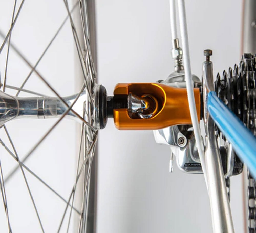 Close-up of SeaSucker Hogg Front Wheel Holder for quick-release bike hubs, showing the mount and secure attachment.