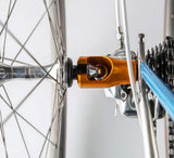 Close-up of SeaSucker Hogg Front Wheel Holder for quick-release bike hubs, showing the mount and secure attachment.