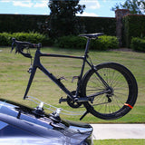 SeaSucker Komodo 1 Bike Rack for sports cars and convertibles, compact roof mount with silver finish, shown installed on a vehicle