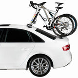 SeaSucker Mini Bomber 2-bike rack for e-bikes, fork-mount vacuum rack installed on car roof for secure transport.