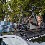 SeaSucker Monkey Bars bike carrier with 9mm quick release fork mount attached to a vehicle roof, ideal for bike transportation.