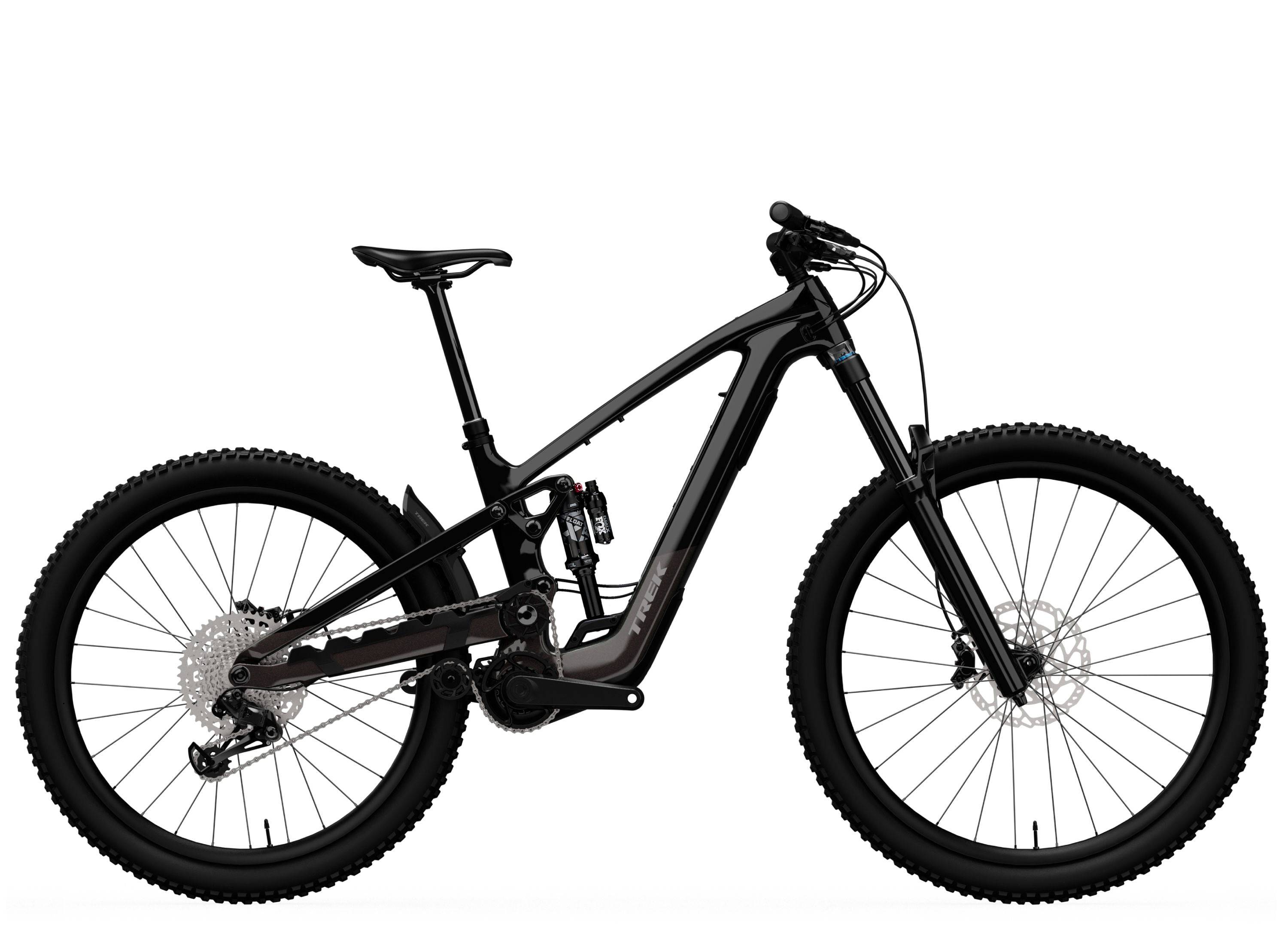 Trek Slash+ 9.7 mountain bike with high-pivot suspension for aggressive trail riding, shown in a dynamic riding position.