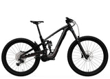 Trek Slash+ 9.7 mountain bike with high-pivot suspension for aggressive trail riding, shown in a dynamic riding position.