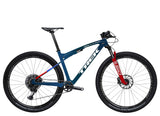 Trek Supercaliber SLR 9.8 XO AXS mountain bike with IsoStrut suspension, black frame and high-performance components.