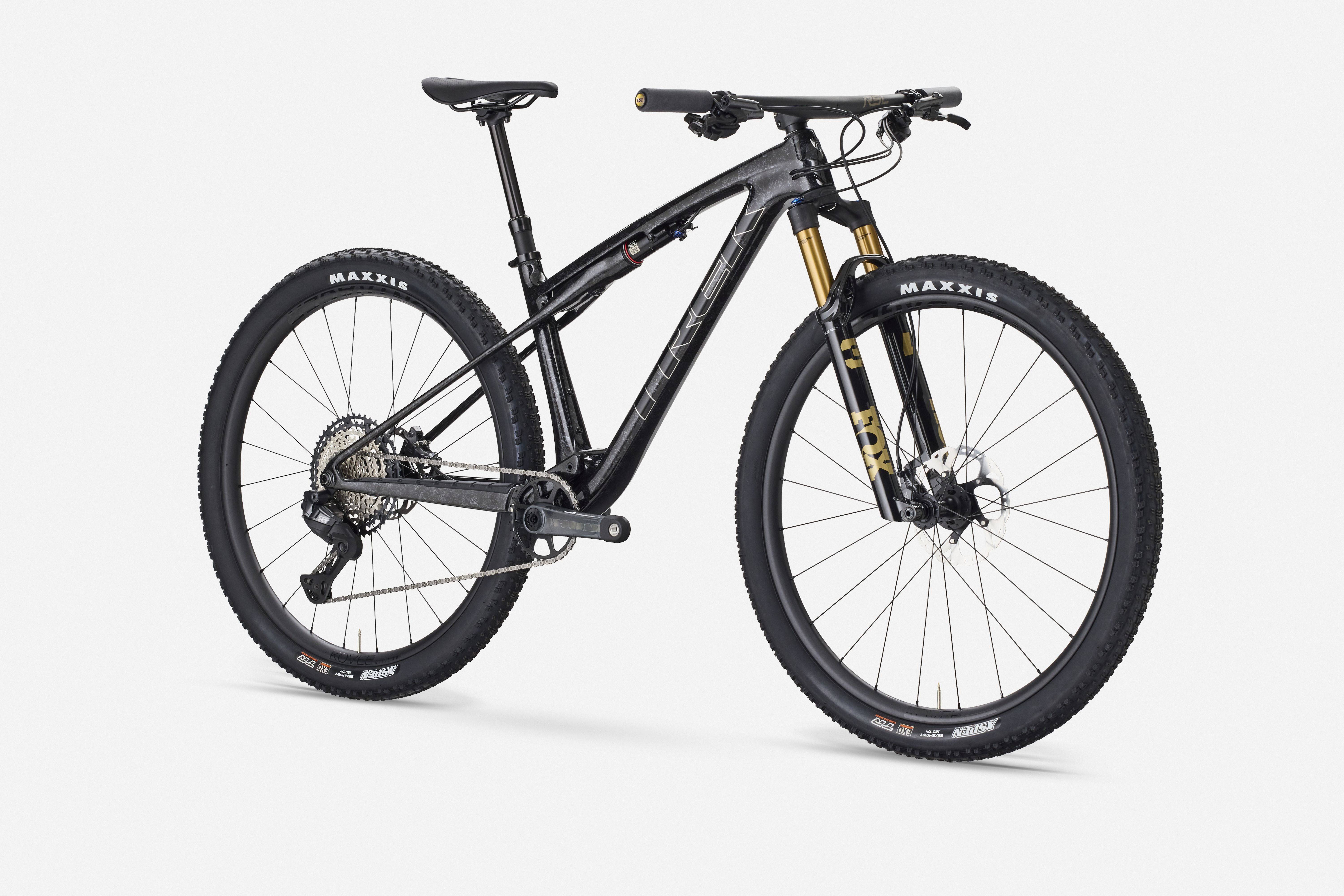 Trek Supercaliber SLR 9.8 XT Di2 mountain bike with IsoStrut suspension, shown in a portrait view.