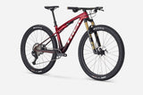 Trek Supercaliber SLR 9.8 XT Di2 mountain bike with IsoStrut suspension system, shown in a portrait view.