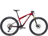 Trek Supercaliber SLR 9.8 XT Di2 mountain bike with IsoStrut suspension and sleek frame, ready for off-road riding.