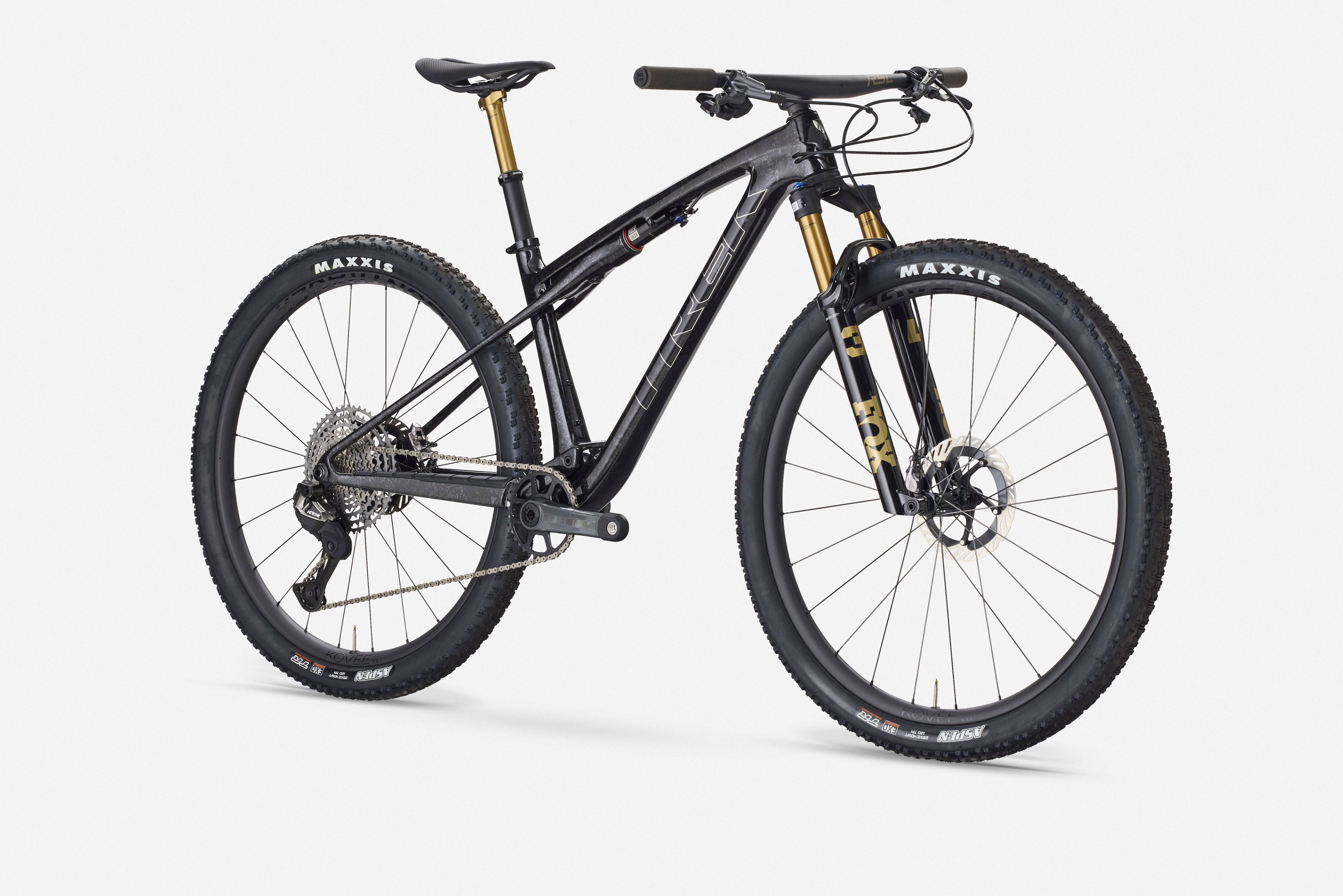 Trek Supercaliber SLR 9.9 XTR Di2 mountain bike with IsoStrut rear suspension and sleek frame design.