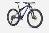 Trek Supercaliber SLR 9.9 XTR Di2 mountain bike with IsoStrut rear suspension and sleek frame design.