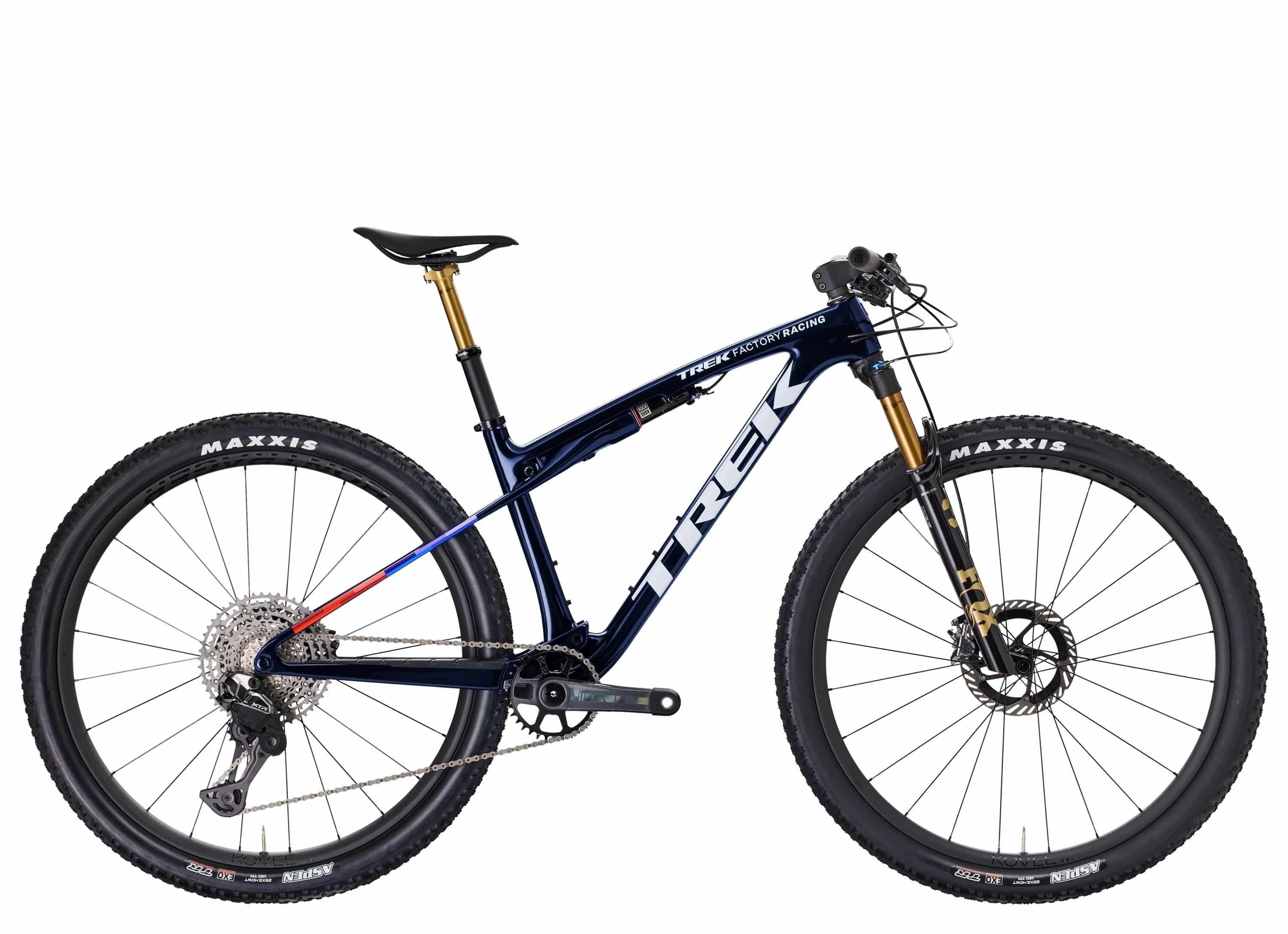 Trek Supercaliber SLR 9.9 XTR Di2 mountain bike with IsoStrut rear suspension, shown in a sleek black and red design.