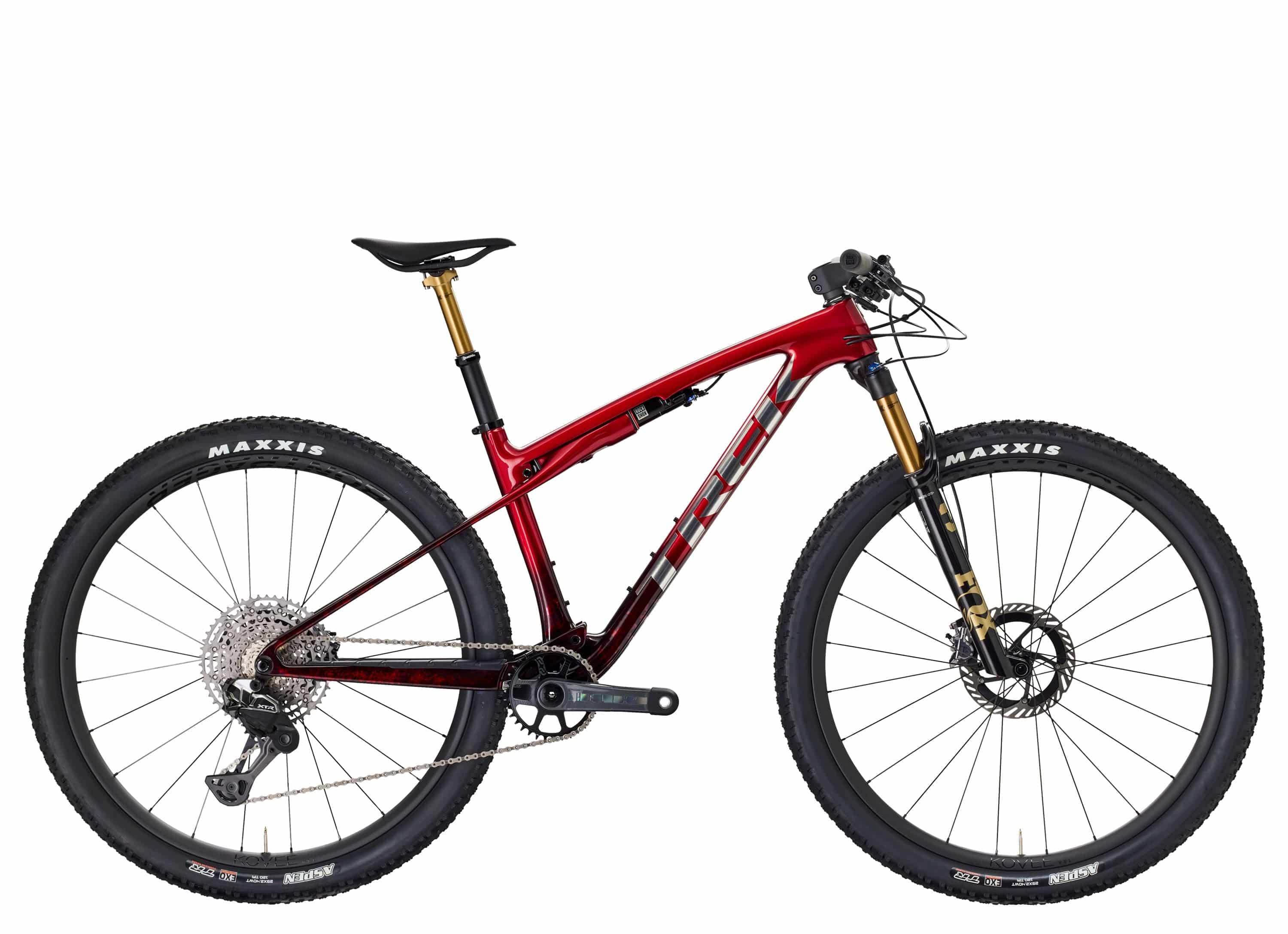 Trek Supercaliber SLR 9.9 XTR Di2 mountain bike with IsoStrut rear suspension, black frame, and advanced gear components.