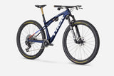 Trek Supercaliber SLR 9.9 XX AXS Flight Attendant cross-country mountain bike, front view showing sleek frame and suspension system.