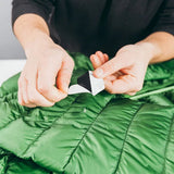 Gear Aid Tenacious Repair Patches for outdoor gear, waterproof fabric repair kit, showing patches and tools in the kit.