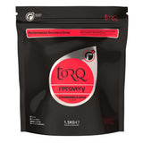 TORQ Recovery Drink with whey protein and carbs, showing a prepared post-exercise supplement in a clear glass.