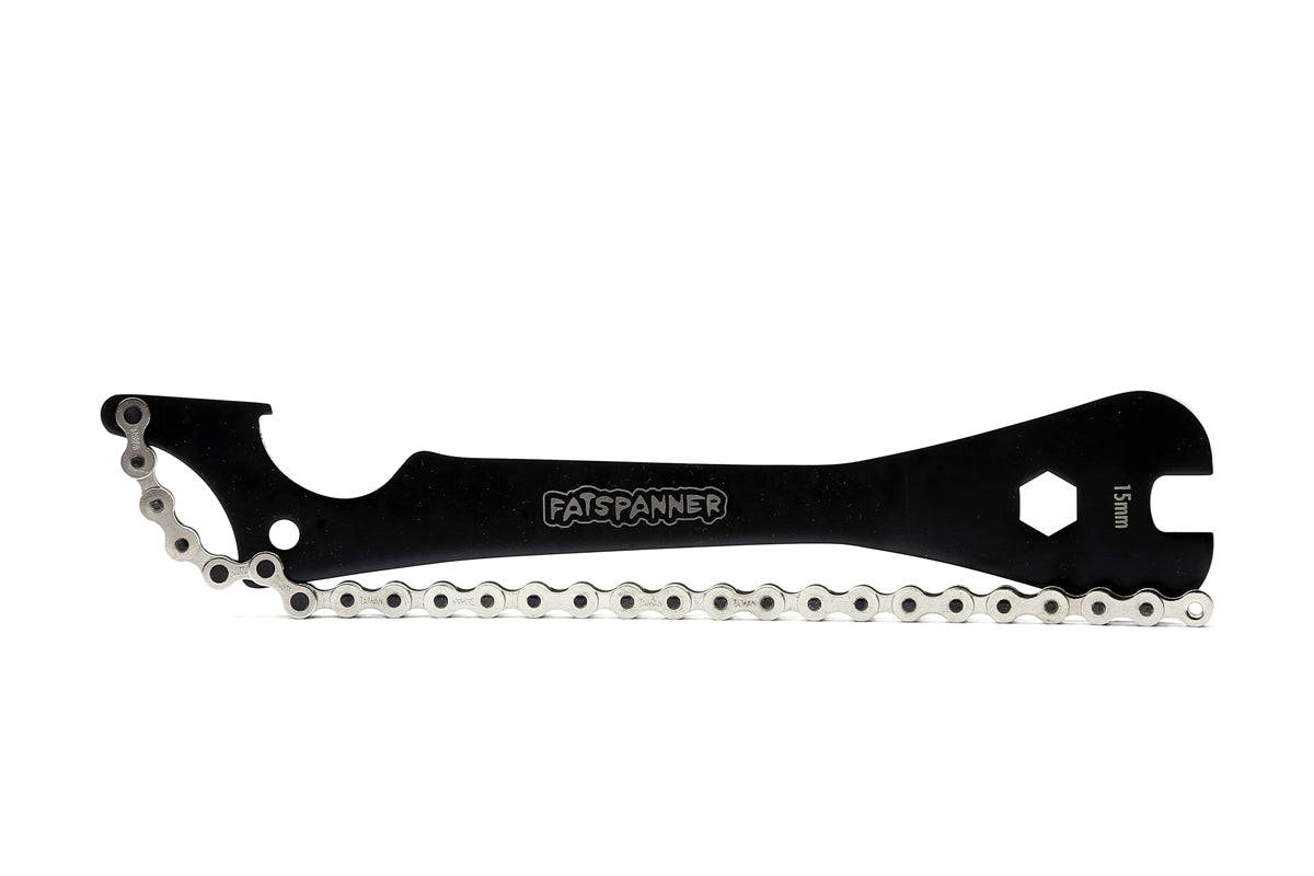 Fat Spanner track spanner tool for precise workshop adjustments and maintenance, featuring a sturdy metal construction.