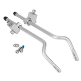 Silver and black Tortec rear rack fittings for bikes, showing secure mounts and spare parts in a close-up view.