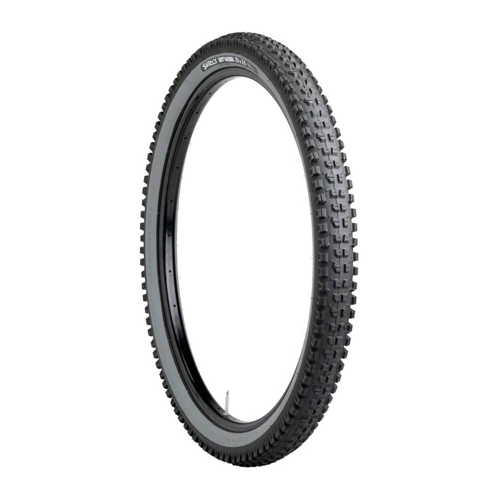 Surly Dirt Wizard 29x2.6" MTB tire with off-road tread pattern, tubeless compatibility, designed for mountain biking trails.