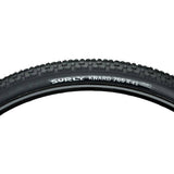 Surly Knard 700x41c tubeless ready mountain bike tire suitable for hardpack and trail riding, shown mounted on a bike wheel.