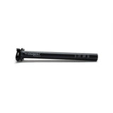 Thomson Masterpiece carbon fiber seatpost with matte finish, titanium hardware, and alloy clamp for lightweight bike components.